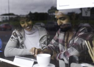 Browsing a Digital Tablet in a Cafe